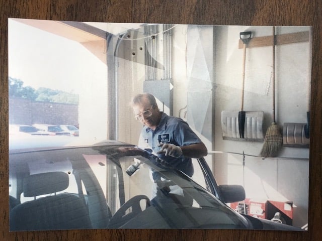 Installer working on a windshield